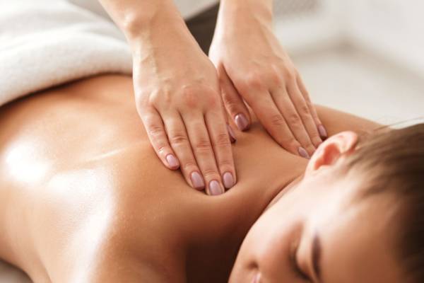 young-woman-enjoying-therapeutic-neck-massage-in-spa-1175433234-a159a445263c470f8ed2087f13bb6a5a
